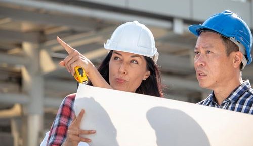 engineer-woman-is-pointing-for-project-manager-to-see-building_t20_axQ2rp.jpg